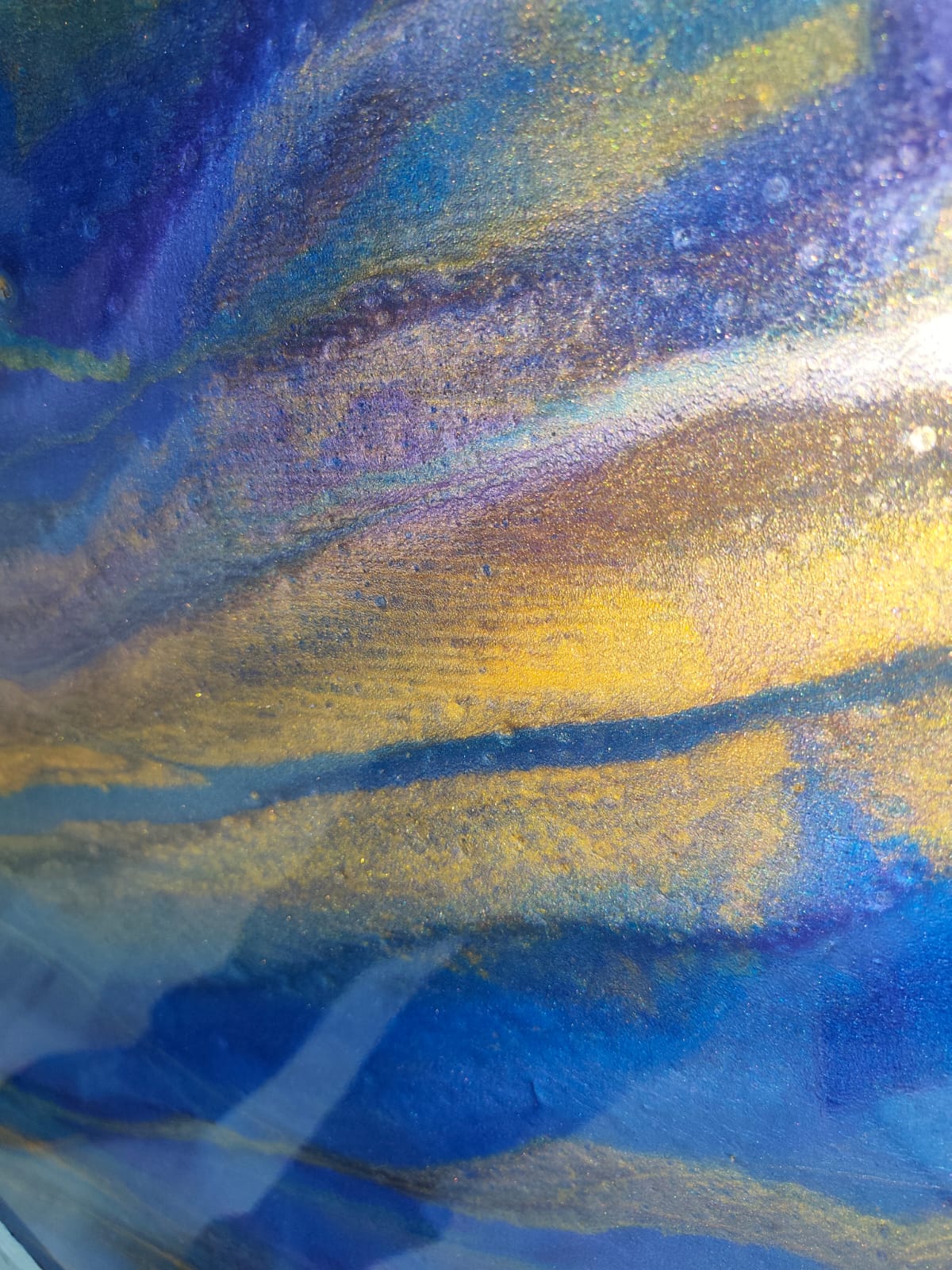 Blue and gold metallic epoxy surface detail