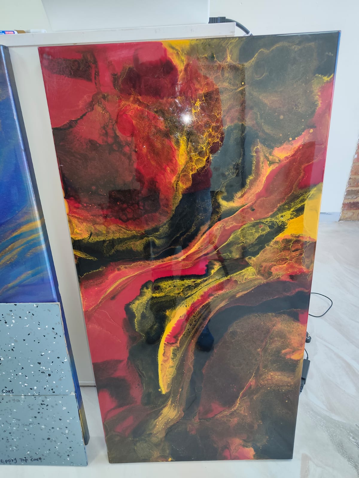 Red, black and gold decorative epoxy sample panel